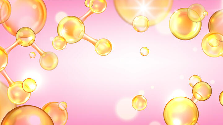 Golden colored collagen  peptide molecules on a soft pink background